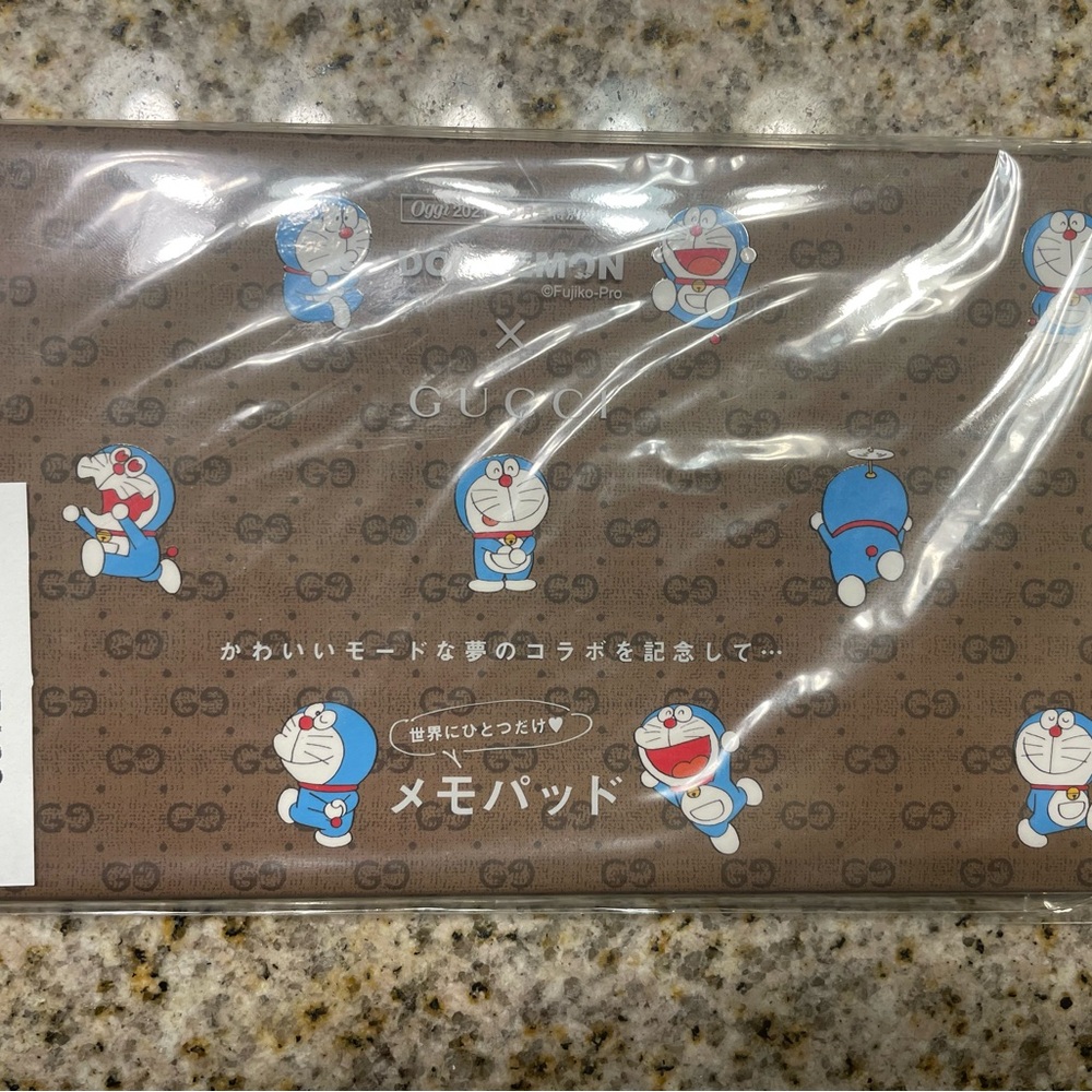 Gucci black leather bifold wallet and brand new Doraemon x Gucci memopad